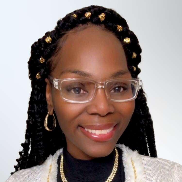 Headshot of Claudia Terrell, a young Black female nonprofit professionals with dark braided hair wearing an ivory jacket and glasses
