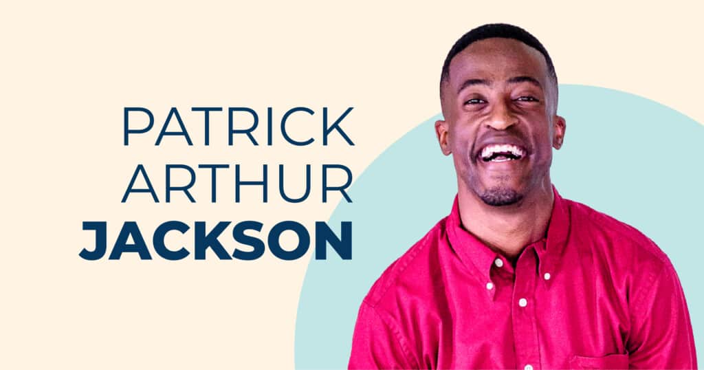 Patrick Arthur Jackson, a Black man smiling joyfully while wearing a red button-down shirt