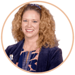 Headshot of Mandy Cloninger, a white woman with curly blond hair wearing a navy suit jacket