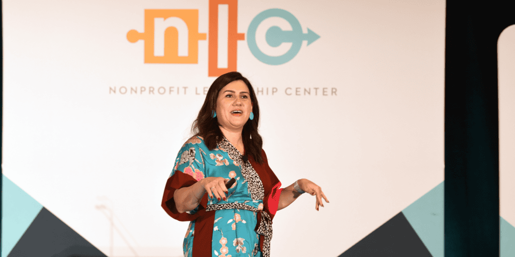 Keynote speaker Shabnam Mogharabi on stage at the Nonprofit Leadership Conference talking to a crowd