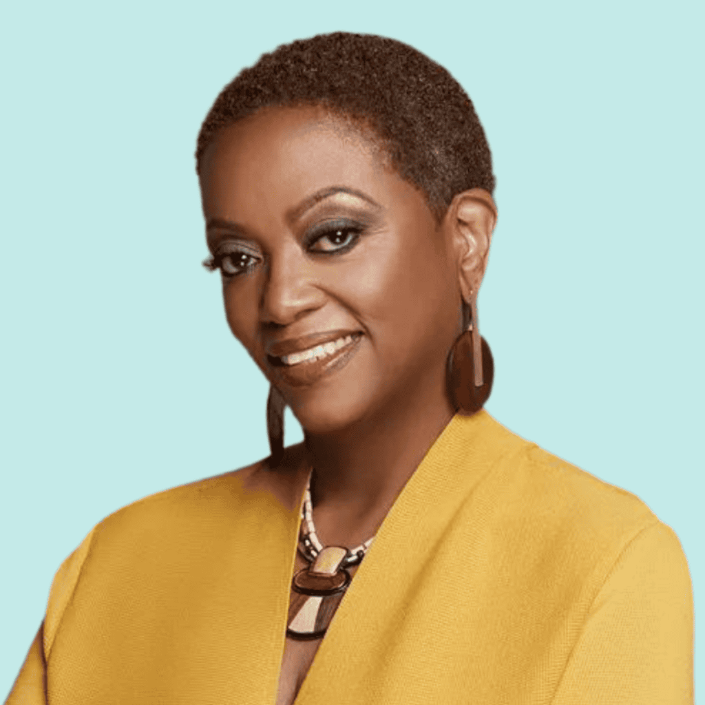 Headshot of Vernetta Walker, a Black woman with short dark hair wearing a yellow jacket and smiling into the camera