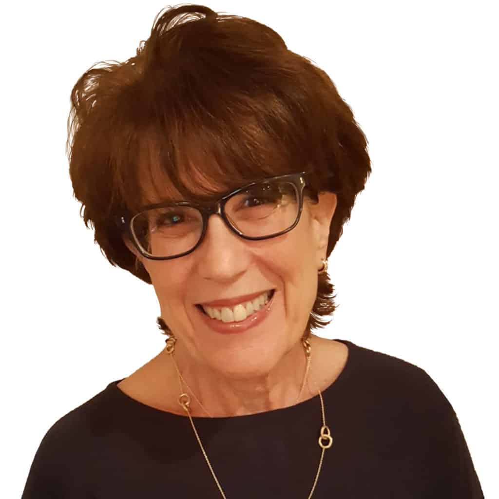 Headshot of Ellen Nastir a white woman in her 60s with short brown hair wearing a black top and glasses